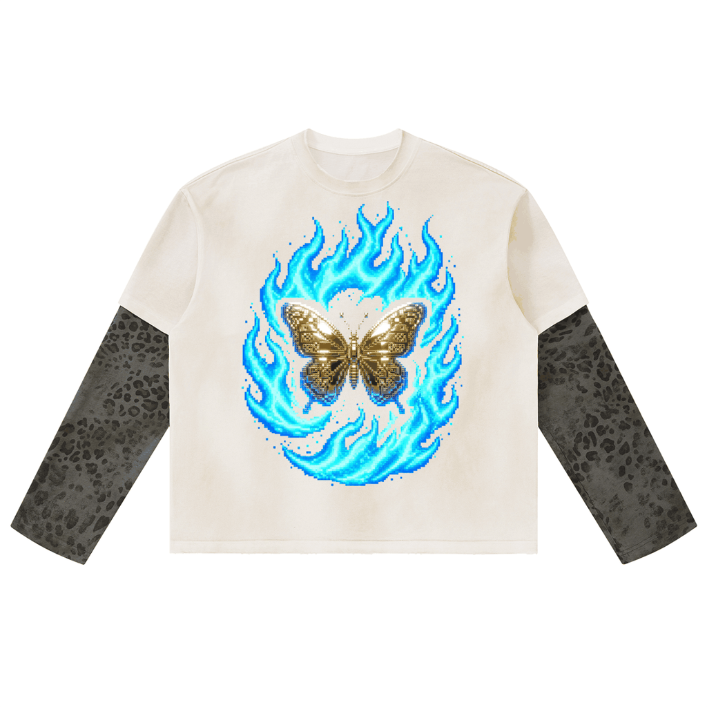 Long-sleeve T-shirt with a cream cotton body, charcoal leopard-print sleeves, and a blue flame graphic surrounding a gold butterfly; Unisex Vintage Wash style.