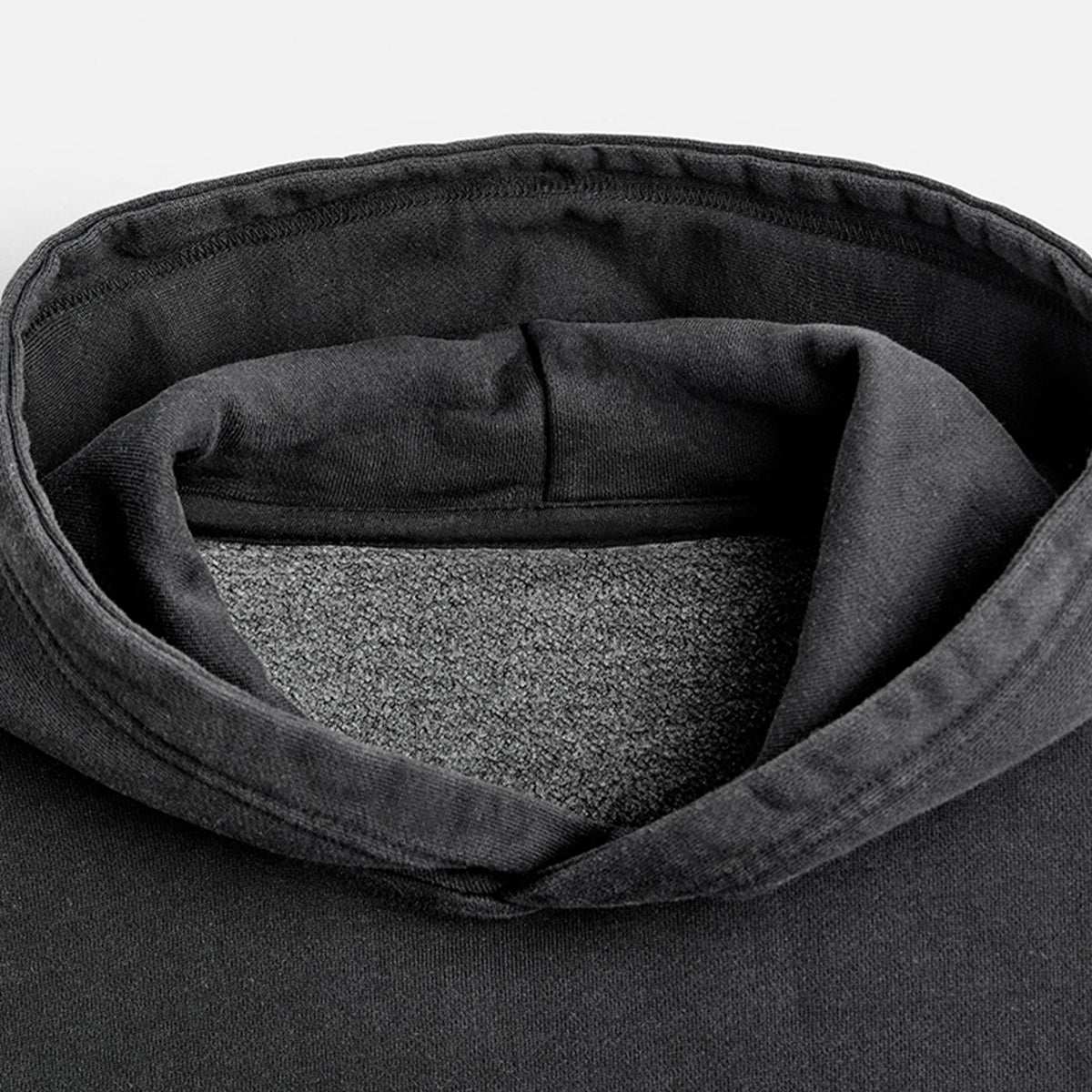 440GSM Unisex Heavyweight hoodie in washed black cotton fleece, showing a thick hood with soft textured lining