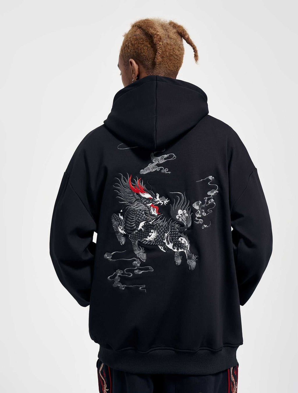 KH9102 Kirin Embroidery Hoodie in black cotton blend, featuring a large gray and white mythical creature embroidery with red accents on the back.